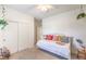 Bright bedroom with a daybed, neutral walls, and modern decor, offering a serene atmosphere at 5500 E Volterra Dr, Pahrump, NV 89061
