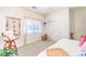 Bright bedroom with a large window, neutral walls, and modern decor at 5500 E Volterra Dr, Pahrump, NV 89061