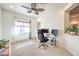 Bright office or bedroom with a ceiling fan, computer set up, and plenty of natural light at 5500 E Volterra Dr, Pahrump, NV 89061