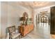 Stylish entry with tile flooring, a decorative wooden console, and elegant light fixtures at 5500 E Volterra Dr, Pahrump, NV 89061