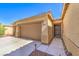 Attractive home showcasing an attached two-car garage and a welcoming front entrance at 5500 E Volterra Dr, Pahrump, NV 89061