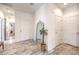 Bright entryway with tile flooring, ample lighting, and decorative full-length mirror at 5500 E Volterra Dr, Pahrump, NV 89061