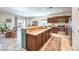 Modern kitchen featuring a breakfast bar, stainless steel appliances, and sleek cabinetry at 5500 E Volterra Dr, Pahrump, NV 89061