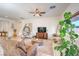 Bright living room features a leaning ladder, egg chair, and lots of natural light at 5500 E Volterra Dr, Pahrump, NV 89061