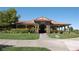 Attractive clubhouse with manicured lawn, paved walkway, covered entrance, and prominent Pro Shop signage at 5500 E Volterra Dr, Pahrump, NV 89061