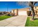 Charming single-story home with a well-manicured lawn, attached garage, and desert landscaping at 5575 Cresent Valley St, Las Vegas, NV 89148