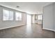 Open-concept living and dining area with tile floors and natural light at 5575 Cresent Valley St, Las Vegas, NV 89148