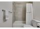 This bathroom features a shower and tub with tile surround and a convenient towel rack at 5725 Smoke Ranch Rd # A, Las Vegas, NV 89108