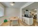 Charming dining area adjacent to the kitchen, featuring a modern table with seating for four at 5725 Smoke Ranch Rd # A, Las Vegas, NV 89108
