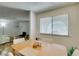Bright dining area featuring a wooden table and seating, filled with natural light at 5725 Smoke Ranch Rd # A, Las Vegas, NV 89108