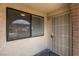 This home features a secure screen door, exterior light, and a neutral color scheme at 5725 Smoke Ranch Rd # A, Las Vegas, NV 89108