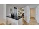 Bright kitchen with stainless steel appliances and modern bar seating area at 5725 Smoke Ranch Rd # A, Las Vegas, NV 89108