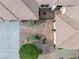 Aerial shot of a home with concrete driveway, mature landscaping, and a tile walkway at 5858 Majestic Tide Ave, Las Vegas, NV 89131