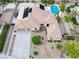 Home's aerial view showcases desert landscaping, a multi-car driveway, and solar panels on the roof at 5858 Majestic Tide Ave, Las Vegas, NV 89131