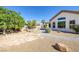 Lush backyard oasis featuring a sparkling pool, mature trees, and serene landscaping for relaxing outdoor living at 5858 Majestic Tide Ave, Las Vegas, NV 89131