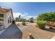 Expansive backyard with mature trees, spacious patio area, and lush landscaping, offering a private retreat at 5858 Majestic Tide Ave, Las Vegas, NV 89131