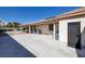 Spacious backyard patio with a covered area, utility access, and room for outdoor activities at 5858 Majestic Tide Ave, Las Vegas, NV 89131