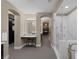 Bright bathroom features dual sinks, vanity, and luxurious glass enclosed shower and tub at 5858 Majestic Tide Ave, Las Vegas, NV 89131