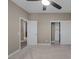 View of bedroom includes a ceiling fan, carpeting, and double closet for plenty of storage at 5858 Majestic Tide Ave, Las Vegas, NV 89131