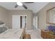View from bed to closet, door and hallway in this carpeted room with a ceiling fan at 5858 Majestic Tide Ave, Las Vegas, NV 89131