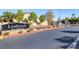Entrance to the Lynbrook gated community with stone accents and professional landscaping at 5858 Majestic Tide Ave, Las Vegas, NV 89131