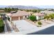 Expansive home featuring a three car garage, mature landscaping, and well maintained exterior at 5858 Majestic Tide Ave, Las Vegas, NV 89131