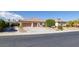 Attractive single-story house features three-car garage, mature trees, and circular drive at 5858 Majestic Tide Ave, Las Vegas, NV 89131