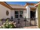 Inviting front courtyard with charming wrought iron fencing and a delightful array of flowering plants at 5858 Majestic Tide Ave, Las Vegas, NV 89131