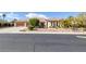 Charming single-story home with three-car garage and beautifully landscaped front yard at 5858 Majestic Tide Ave, Las Vegas, NV 89131