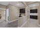 Bright hallway features dark cabinetry, a countertop workspace and entry to the bedroom at 5858 Majestic Tide Ave, Las Vegas, NV 89131