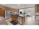 Open-concept kitchen featuring a large island, stainless steel appliances, and seamless flow to the living area at 5858 Majestic Tide Ave, Las Vegas, NV 89131
