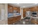 A spacious kitchen featuring stainless steel appliances, custom cabinets, and granite countertops at 5858 Majestic Tide Ave, Las Vegas, NV 89131