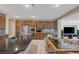 Gourmet kitchen with stainless steel appliances, custom cabinets, and black granite countertop at 5858 Majestic Tide Ave, Las Vegas, NV 89131