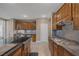 Spacious kitchen featuring granite countertops, stainless steel appliances, and custom cabinetry at 5858 Majestic Tide Ave, Las Vegas, NV 89131