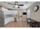 Spacious kitchen features stainless steel appliances, white cabinetry, and breakfast nook at 5858 Majestic Tide Ave, Las Vegas, NV 89131