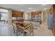 Open kitchen with custom cabinets, stainless steel appliances and granite countertop with island seating at 5858 Majestic Tide Ave, Las Vegas, NV 89131