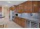 Gourmet kitchen showcasing stainless steel appliances, built-in wine cooler, and abundant storage space at 5858 Majestic Tide Ave, Las Vegas, NV 89131