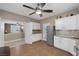 Bright kitchen area features stainless steel appliances, white cabinets and stylish countertops at 5858 Majestic Tide Ave, Las Vegas, NV 89131