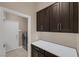 Laundry room with cabinets and plenty of counter space by the door at 5858 Majestic Tide Ave, Las Vegas, NV 89131