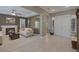 Open-concept living room features tile flooring, a fireplace, and seamless access to other living spaces at 5858 Majestic Tide Ave, Las Vegas, NV 89131