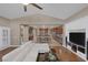 Bright living room with hardwood floors, built-in shelving, and open access to kitchen at 5858 Majestic Tide Ave, Las Vegas, NV 89131