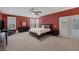 Spacious main bedroom with tray ceiling, plantation shutters, and ensuite bathroom at 5858 Majestic Tide Ave, Las Vegas, NV 89131