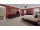 Expansive main bedroom featuring an ensuite bathroom, tray ceilings, and ample natural light at 5858 Majestic Tide Ave, Las Vegas, NV 89131