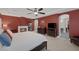 Spacious main bedroom with fireplace, ceiling fan, and ensuite bathroom at 5858 Majestic Tide Ave, Las Vegas, NV 89131