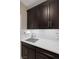Mud room with a sink and dark cabinets offers plenty of counter space at 5858 Majestic Tide Ave, Las Vegas, NV 89131