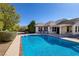 Sparkling backyard pool with a large patio area, perfect for outdoor entertainment and relaxation at 5858 Majestic Tide Ave, Las Vegas, NV 89131