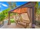 Backyard dining area with a grill, picnic table and gazebo at 6046 Bassio Ave, Las Vegas, NV 89141