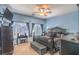 Elegant bedroom with dark wood furniture, carpet, and a window for natural light at 6046 Bassio Ave, Las Vegas, NV 89141