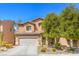 Charming two-story home with a well-maintained front yard and attached two-car garage at 6046 Bassio Ave, Las Vegas, NV 89141