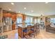 Open kitchen with granite countertops, stainless steel appliances, and a large center island at 6046 Bassio Ave, Las Vegas, NV 89141